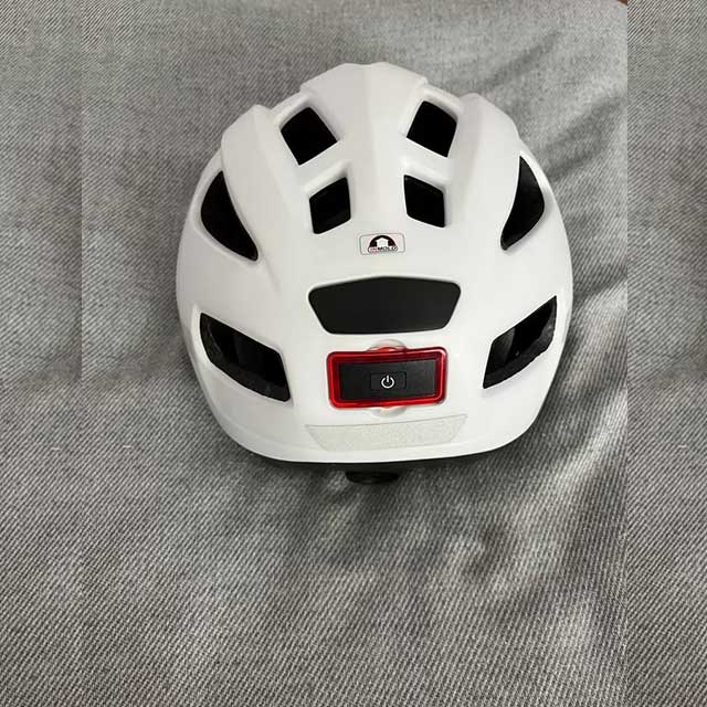 Bicycle helmet with removable rear light