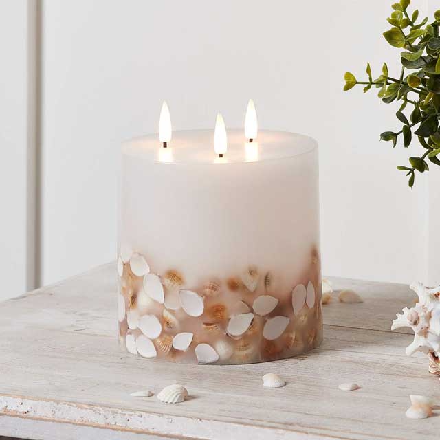 Lights4fun TruGlow® Ivory Wax Pillar Candle – 3 Wick LED, Shell Decorated, Battery Operated Indoor Warm White Candle