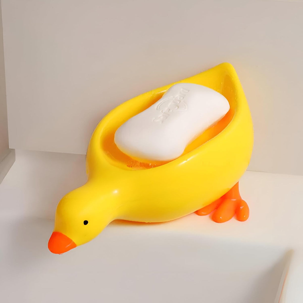 Porte-savon créatif en forme de canard à drainage automatique – Joli porte-savon animal pour salle de bain et cuisine – Porte-savon de douche décoratif antidérapant – Support de lavabo amusant pour enfants et décoration d'intérieur (jaune / blanc)
