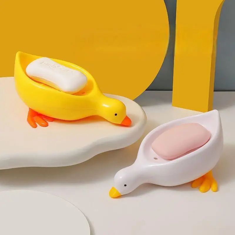 Porte-savon créatif en forme de canard à drainage automatique – Joli porte-savon animal pour salle de bain et cuisine – Porte-savon de douche décoratif antidérapant – Support de lavabo amusant pour enfants et décoration d'intérieur (jaune / blanc)