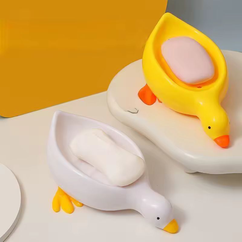 Porte-savon créatif en forme de canard à drainage automatique – Joli porte-savon animal pour salle de bain et cuisine – Porte-savon de douche décoratif antidérapant – Support de lavabo amusant pour enfants et décoration d'intérieur (jaune / blanc)